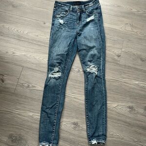 Buckle black skinny jeans